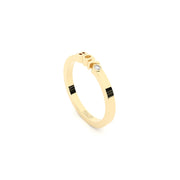 A solid yellow gold ring with the finest quality laboratory made diamond, featuring the inscription 'BOY' on it.