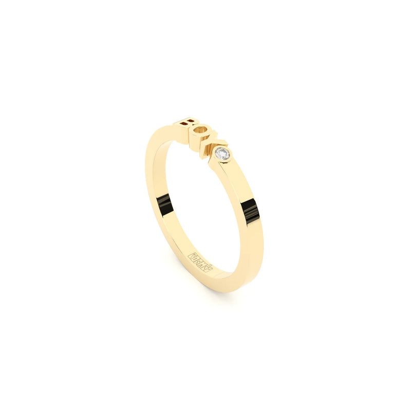A solid yellow gold ring with the finest quality laboratory made diamond, featuring the inscription 'BOY' on it.