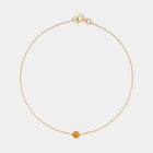 Gold bracelet with small Baltic amber by Adele Notes.