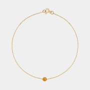 Gold bracelet with small Baltic amber by Adele Notes.
