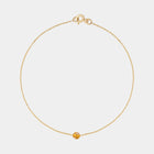 Gold bracelet with small Baltic amber by Adele Notes.