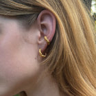 Gold-plated silver earrings inspired by coral shapes.