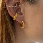 Gold-plated silver earrings inspired by coral shapes.
