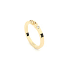 A solid yellow gold ring with the finest quality laboratory made diamond, featuring the inscription 'GIRL' on it.