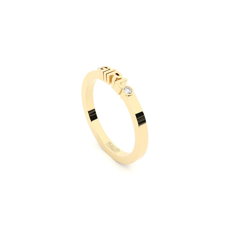 A solid yellow gold ring with the finest quality laboratory made diamond, featuring the inscription 'GIRL' on it.