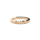 Rose gold ring with 'MAMA' engraving on a white background