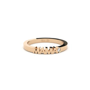 Rose gold ring with 'MAMA' engraving on a white background