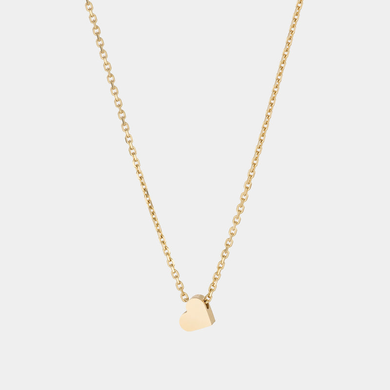 A yellow gold necklace with a heart-shaped pendant.