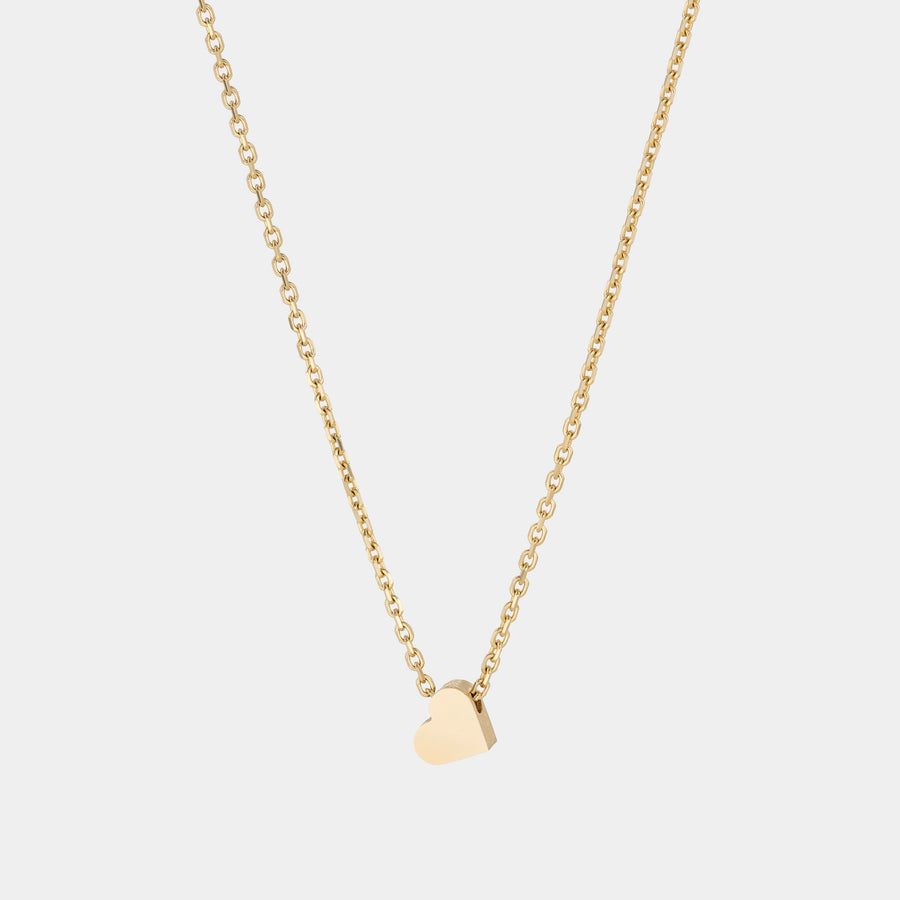 A yellow gold necklace with a heart-shaped pendant.