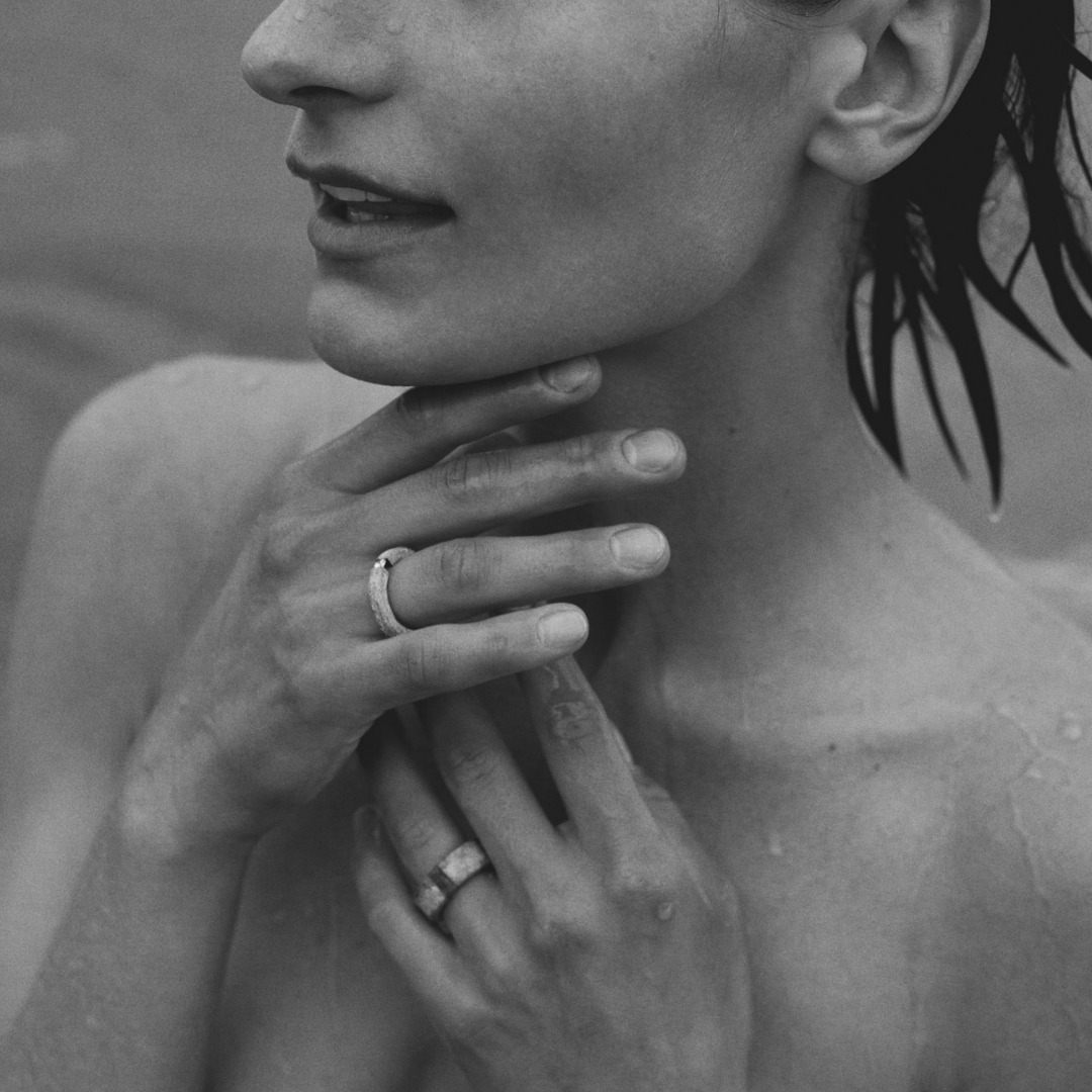 Woman wearing one-of-a-kind ring composed of tantalum and a white diamond by ASR JWLS.