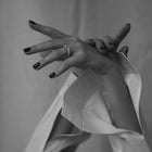 Hand wearing one-of-a-kind ring composed of tantalum and a white diamond by ASR JWLS.