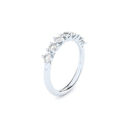 Unique half eternity band handcrafted in white gold. Set with the finest quality laboratory made diamonds.