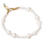 An 18K gold plated bracelet featuring freshwater pearls, with a gold-plated clasp.