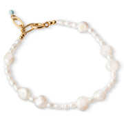 An 18K gold plated bracelet featuring freshwater pearls, with a gold-plated clasp.