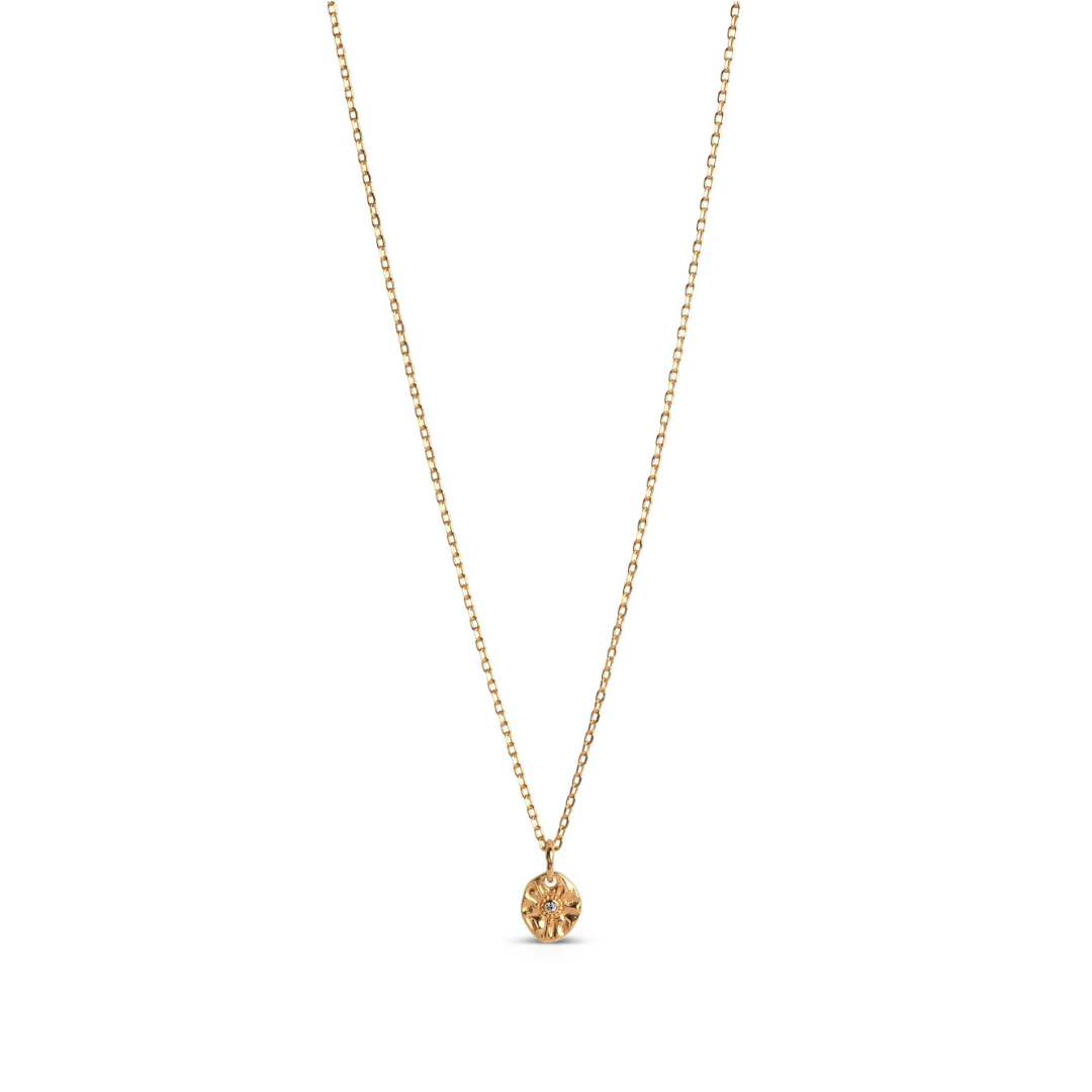 A gold-plated silver necklace with a small, gold-colored pendant featuring a cubic zirconia stone, displayed against a white background.