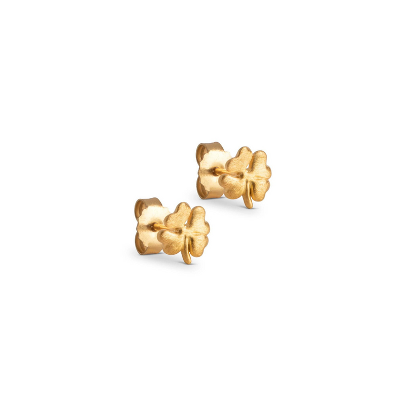 A pair of gold-plated silver stud earrings in an organic clover shape, placed on a white background.