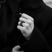 Hand wearing a one-of-a-kind ring composed of niobium and a white diamond by ASR JWLS.