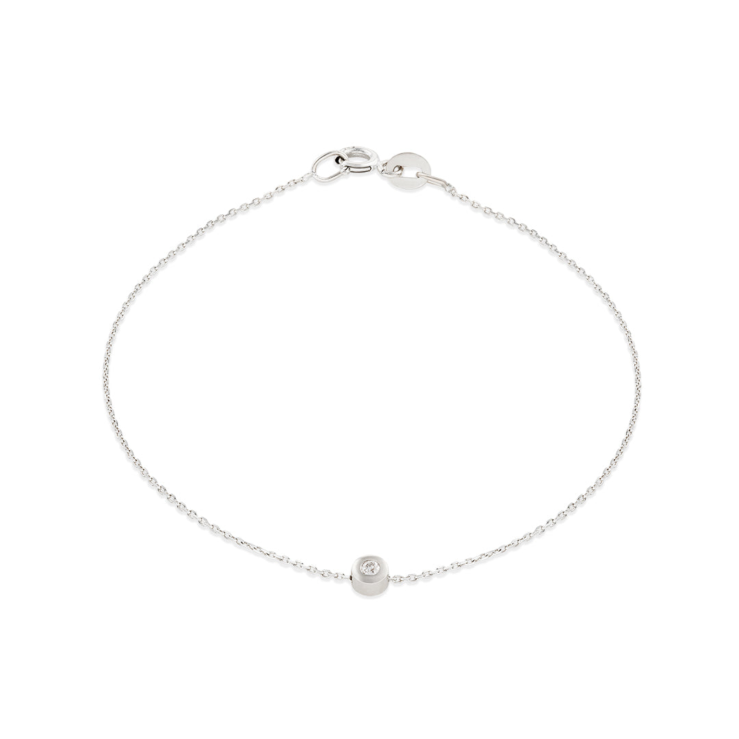 A 14k white gold bracelet with a single white diamond, featuring a simple chain design.