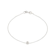 A 14k white gold bracelet with a single white diamond, featuring a simple chain design.