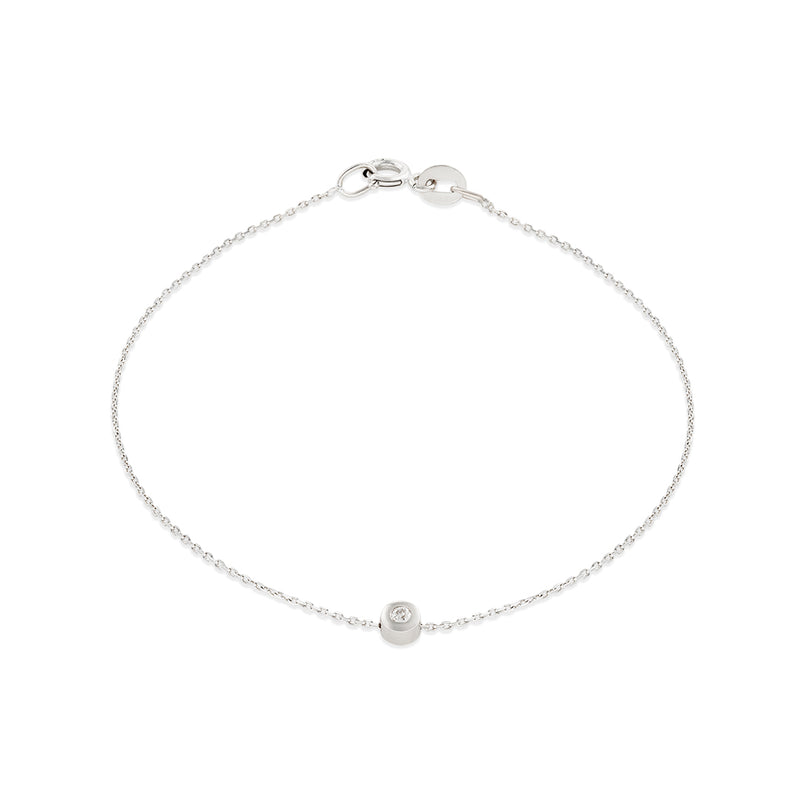 A 14k white gold bracelet with a single white diamond, featuring a simple chain design.