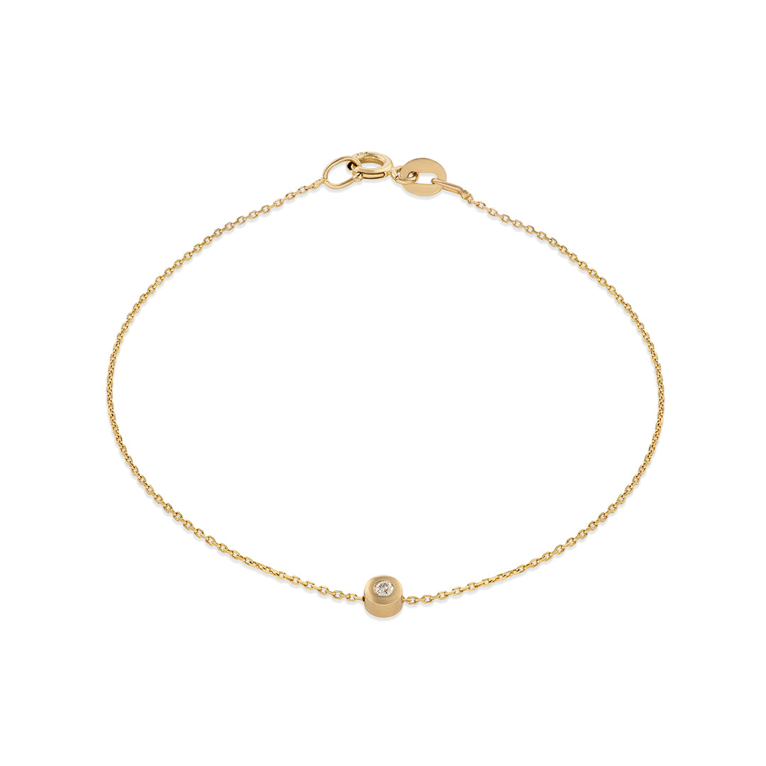 A 14k yellow gold bracelet with a white diamond accent, featuring a simple chain design.