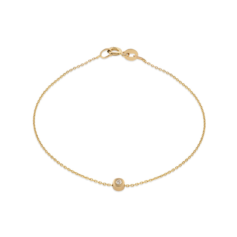 A 14k yellow gold bracelet with a white diamond accent, featuring a simple chain design.