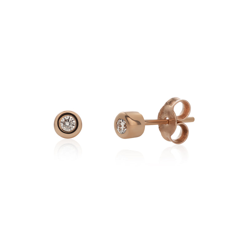 A pair of 14k rose gold basic stud earrings with white diamonds, displayed against a white background.