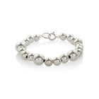Statement bracelet crafted from fine sterling silver beads in varying sizes. 