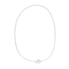Delicate freshwater pearl necklace featuring organically shaped pearls and a minimalist silver clasp against white background.