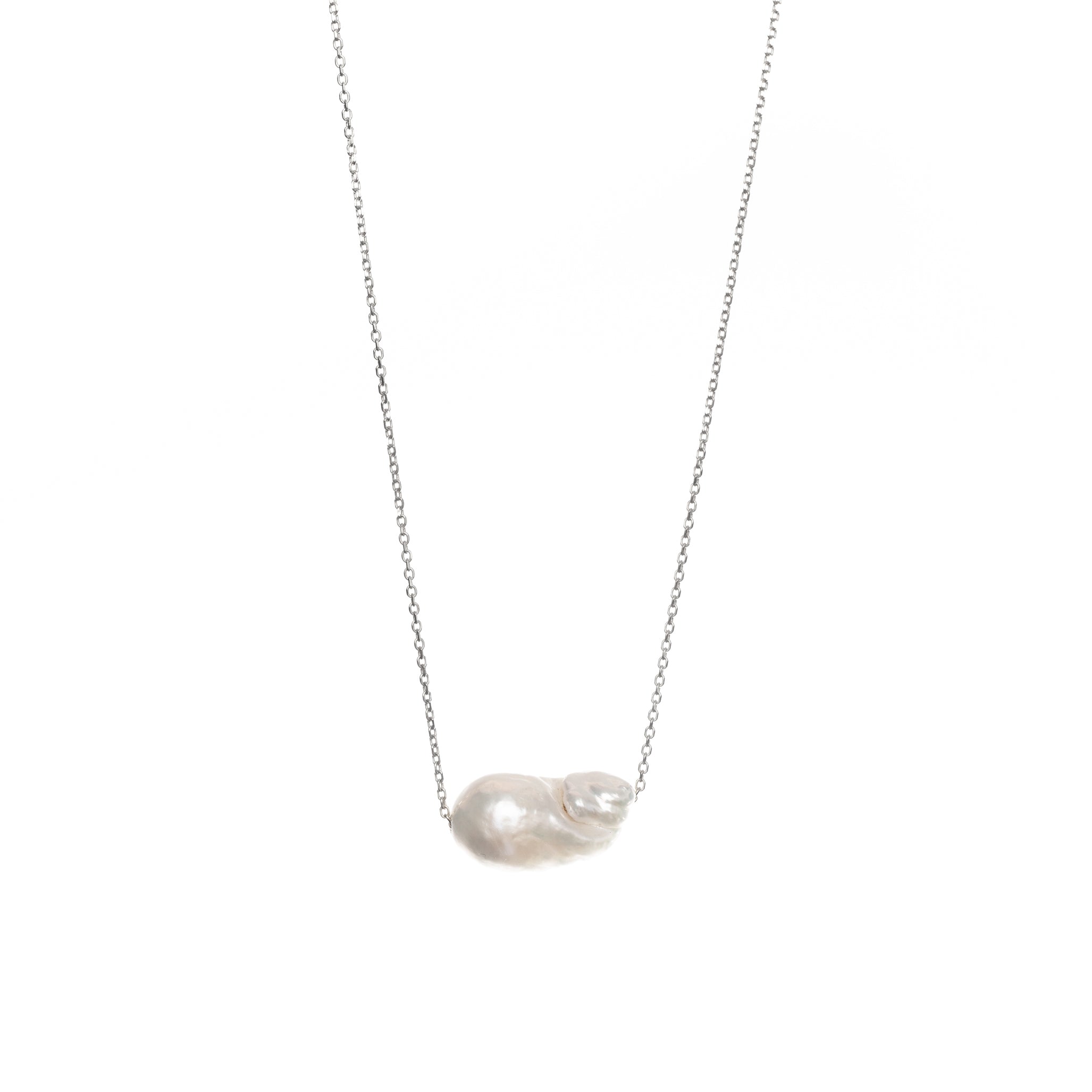 Baroque-shaped freshwater pearl suspended from a delicate white gold chain on a white background.