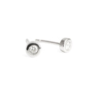 A pair of 14k white gold stud earrings with diamonds set in them.