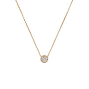 Yellow gold pendant featuring a round brilliant-cut diamond, suspended from a delicate gold chain. 