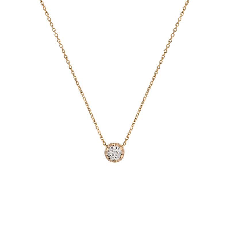 Yellow gold pendant featuring a round brilliant-cut diamond, suspended from a delicate gold chain. 