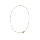 Delicate freshwater pearl necklace featuring organically shaped pearls and a minimalist yellow gold clasp against white background.