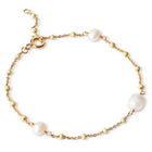 An 18K gold-plated bracelet featuring three freshwater pearls and enamel balls, with a gold-plated chain.