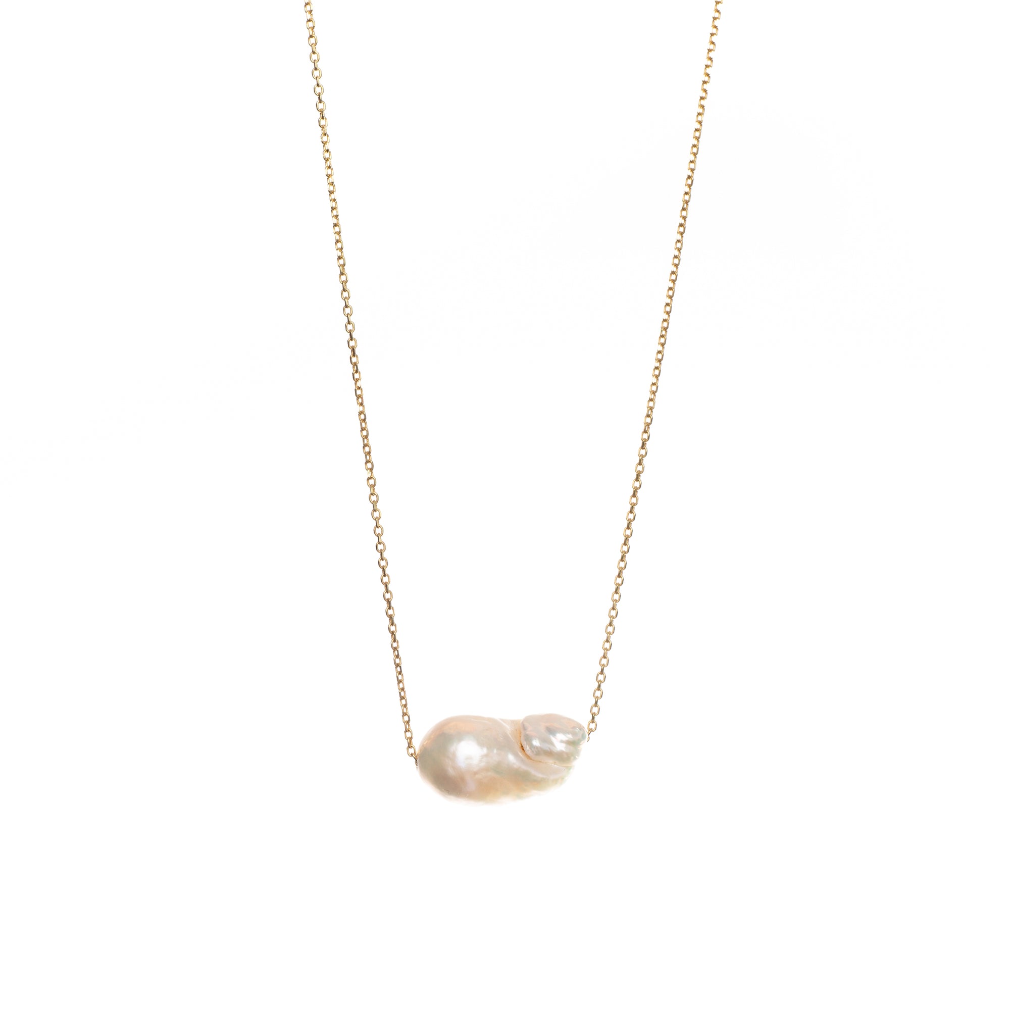Unique baroque-shaped freshwater pearl suspended from a delicate yellow gold chain. 