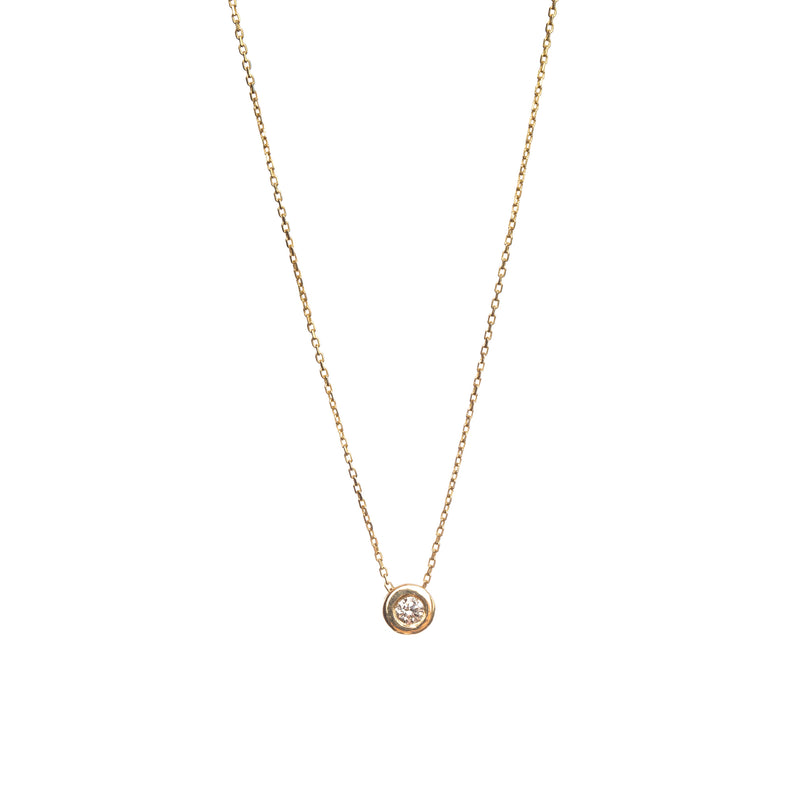 A simple gold choker necklace with a small diamond pendant in the center, presented on a white background.