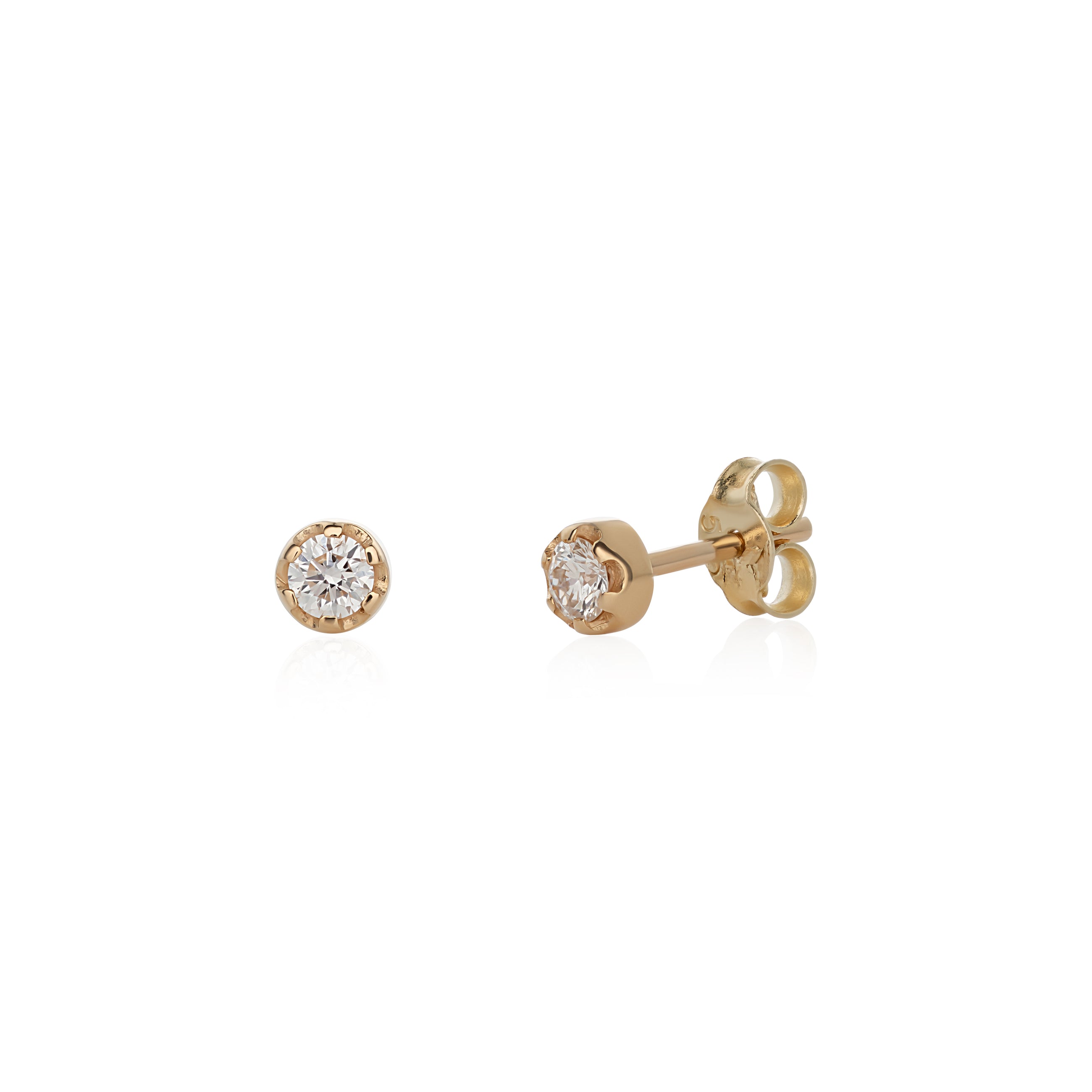 A pair of 14k yellow gold stud earrings with white diamonds attached to the studs.