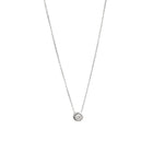 White gold pendant featuring a round brilliant-cut diamond, suspended from a delicate gold chain.