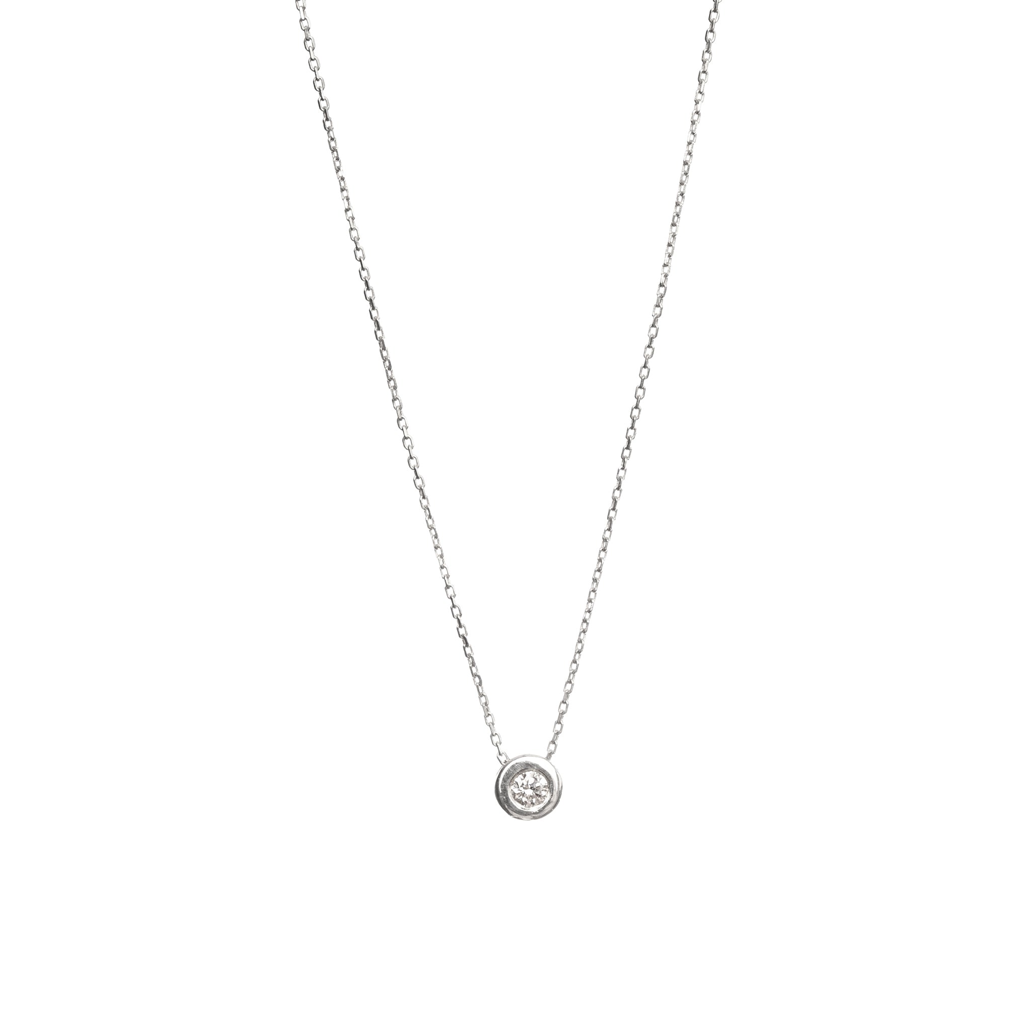White gold pendant featuring a round brilliant-cut diamond, suspended from a delicate gold chain.